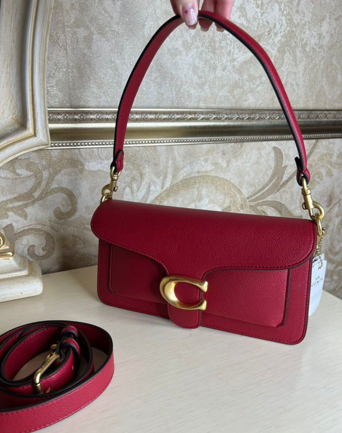 Heritage Compact Shoulder Bag in Deep Carmine with Sculpted Gold Emblem