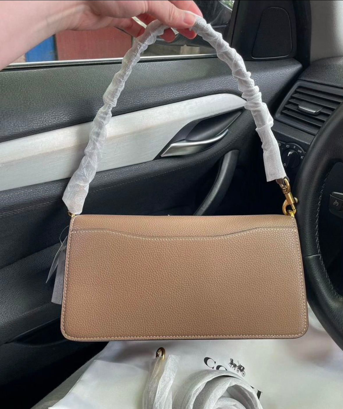 Heritage Compact Shoulder Bag in Warm Taupe with Sculpted Gold Emblem