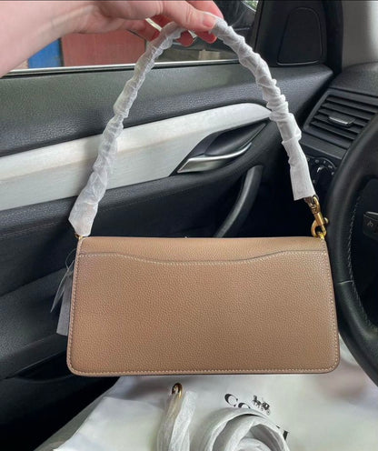 Heritage Compact Shoulder Bag in Warm Taupe with Sculpted Gold Emblem