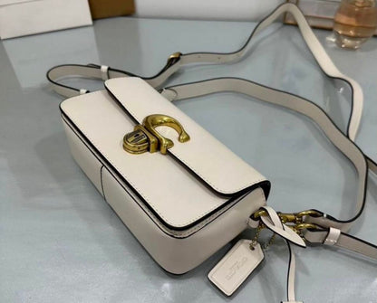 Heritage Compact Shoulder Bag in Soft Ivory with Sculpted Gold Emblem