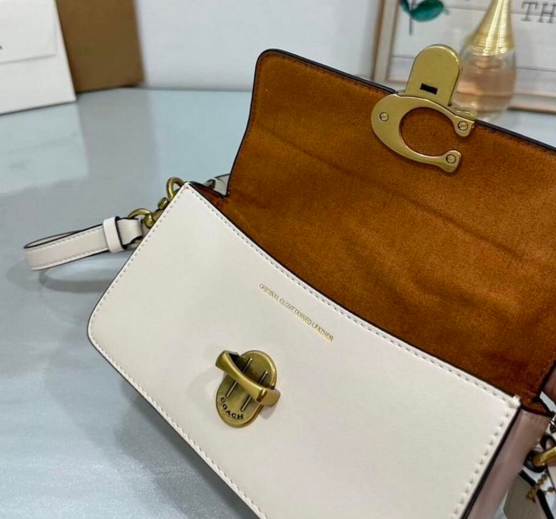 Heritage Compact Shoulder Bag in Soft Ivory with Sculpted Gold Emblem