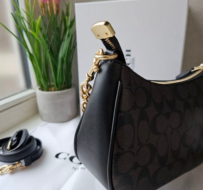 Teri Shoulder Bag — Signature Canvas with Black and Brown Accents