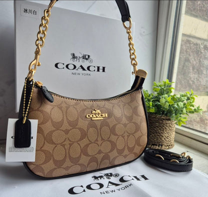 Teri Shoulder Bag — Elegant Signature Canvas in Tan with Gold Accents