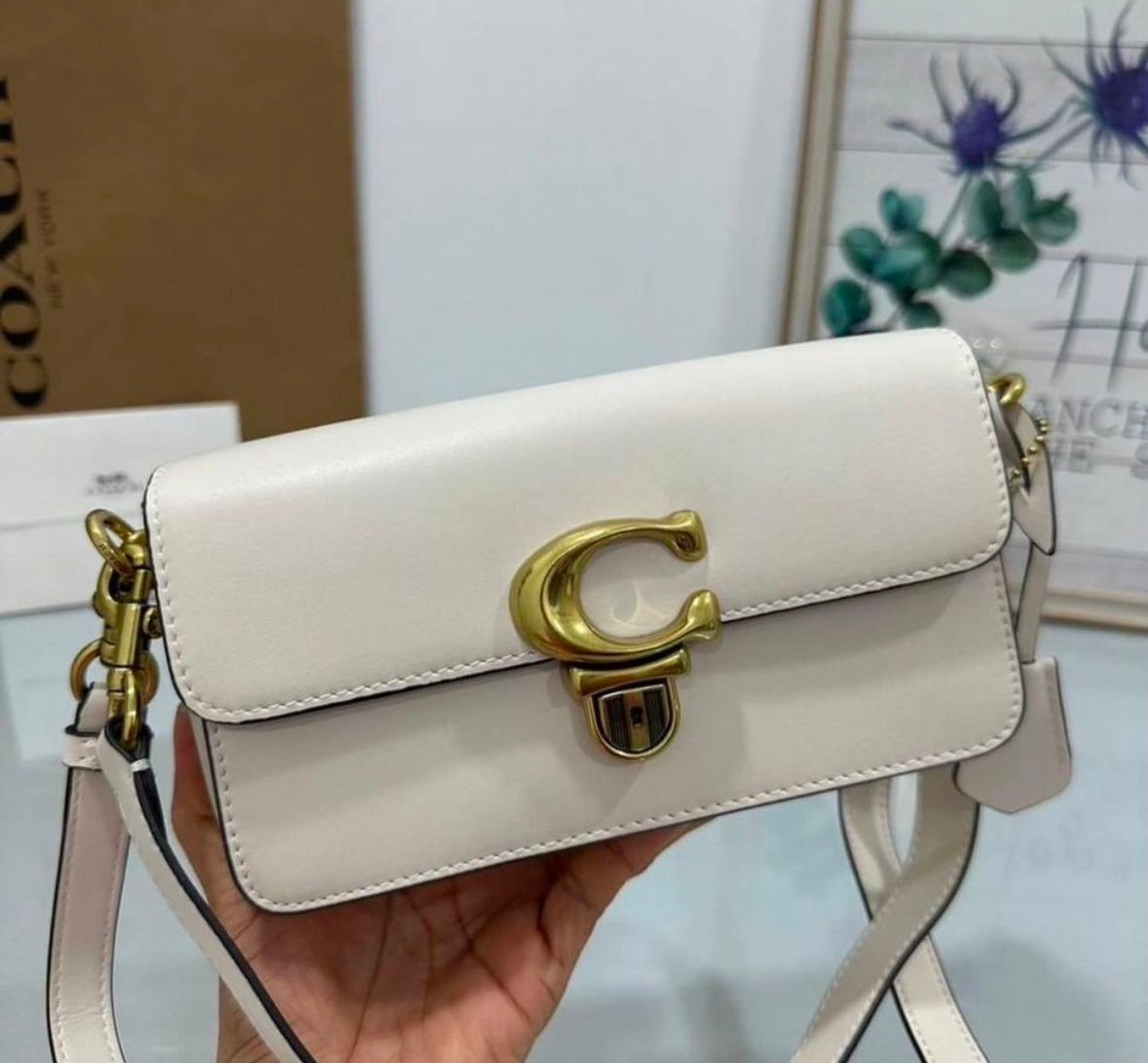 Heritage Compact Shoulder Bag in Soft Ivory with Sculpted Gold Emblem