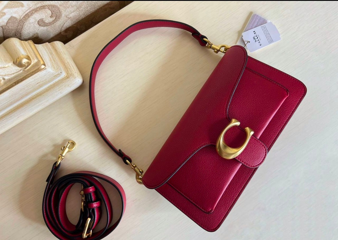 Heritage Compact Shoulder Bag in Deep Carmine with Sculpted Gold Emblem