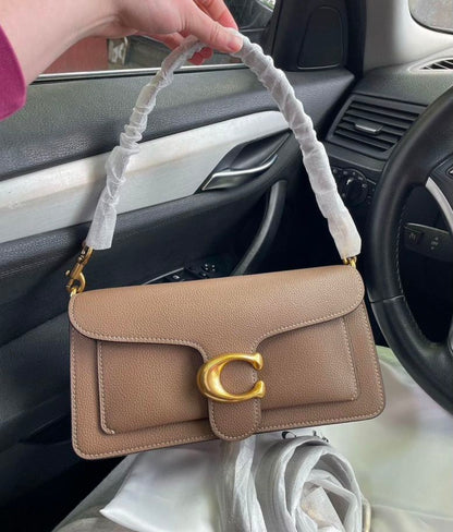 Heritage Compact Shoulder Bag in Warm Taupe with Sculpted Gold Emblem