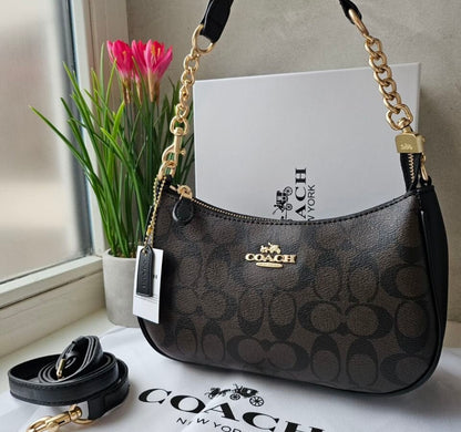 Teri Shoulder Bag — Signature Canvas with Black and Brown Accents