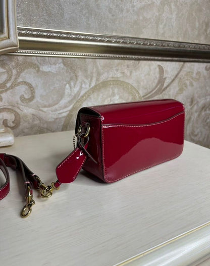 Heritage Compact Shoulder Bag in Glossy Crimson with Sculpted Gold Emblem